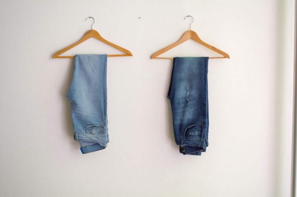 two hanged blue stonewash and blue jeans
